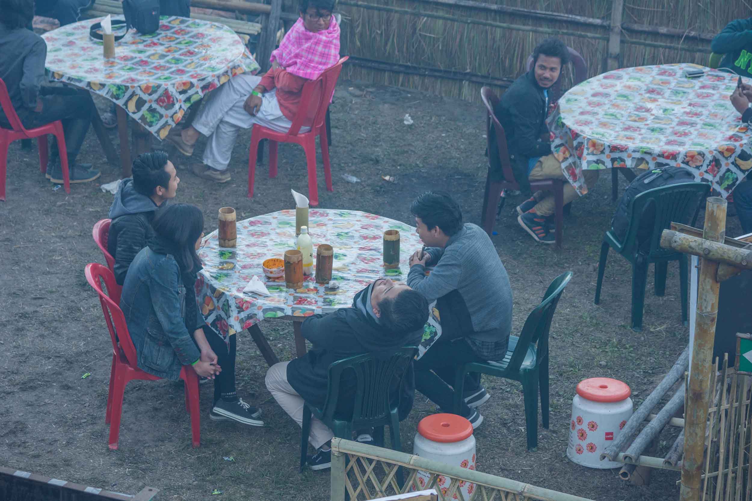 People enjoying local food and beer at the Nagaland Hornbill Festival