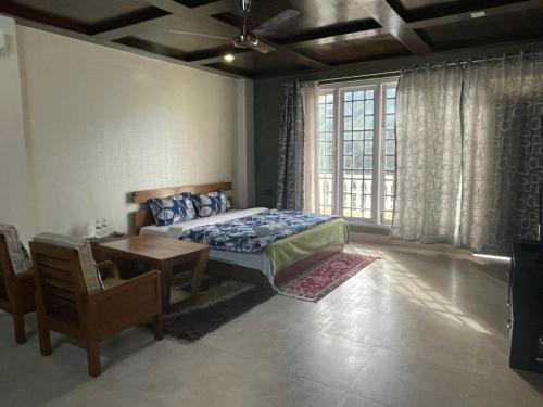 Spacious bedroom at our Dirang homestay